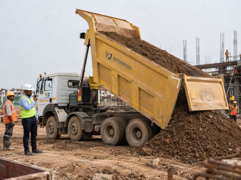 VJ Enterprises tipper truck unloading excavated material on site